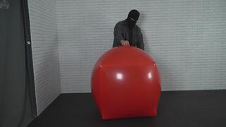 Transforming an inflatable red rubber ball into a vacuum latex cube