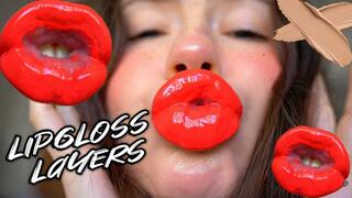 Red sticky messy lipgloss layers and pouting kisses