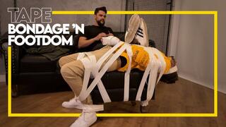 Hex transforms Tonny into his new footrest using duct tape bondage (1080p) Male Bondage - Gay Foot Domination - Gay Bondage - Sneaker Fetish - Tape Bondage - Foot Fetish - BDSM