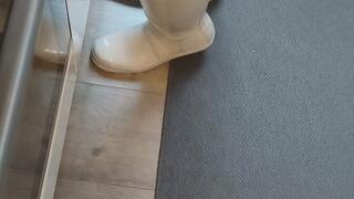 Carina bakes bread wearing leather shorts and sexy knee-high socks with Hunter boots.
