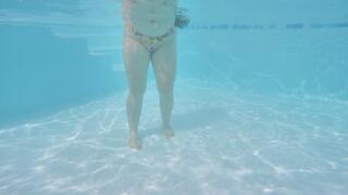 SFW - Beautiful teen swimming underwater