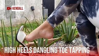 Young woman with pretty feet leaves her high heels dangling (5)