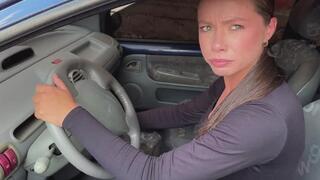 Katiuska in sneakers, learning to start the old car, wheels spinning in place, frustrating pedal pumping.