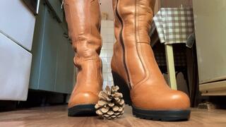 Trampling a pine cone with boots!