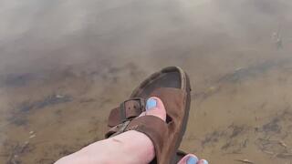 Birkenstock dangles by the sea