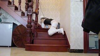 BC16-An Asian girl with bandages wrapped around her neck was walked on a leash like a puppy.