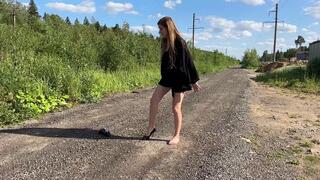 Twisted ankle, girl trying to walk on high heels with sprained foot, one shoe walk, foot massage, twisted ankle, walking on high heels.