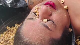 Masala enjoys her cereal and milk on her face!