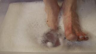 Soapy Foot Wash With Purple Water