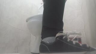 Lola goes to the bathroom at her workplace in an emergency.