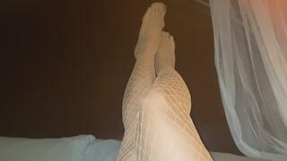 29. Melove Sexy legs in White Fishnet and dark nail polish