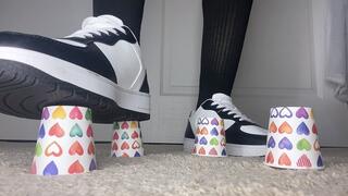 Sneakers Crushing Plastic and Paper Cups