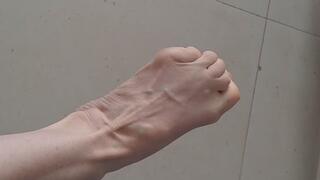 Foot dangle, stretch, and dry sole over dirty floor.