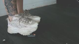 Giantess goddess Charlie Caroline Crushes a 1981 Toyota Celica in big white chunky trainers left close up view