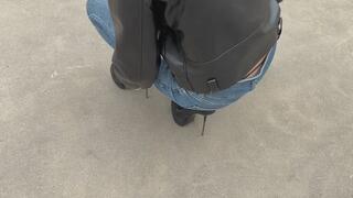 The girl was walking in very uncomfortable shoes and eventually fell and twisted her leg