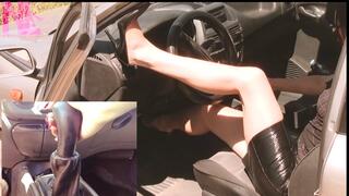 Revving in black barefoot and footjob to gearstick