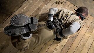 Heavy Metal Hogtie - Heavy and Elise Graves - Elise takes her prisoner to the basement for an extremely SECURE metal hogtie and huge gag that is locked to the floor!