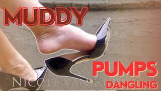 Dangling muddy pump - Posh Mistress Nicole with dirty black high heels in the gardens - sandy soles