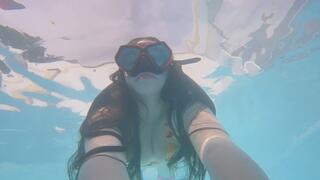 swimming practice with snorkeling equipment underwater in a pool