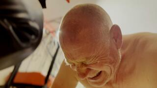 Extreme waxing the bald head of the prisoner