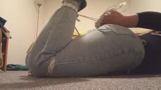 Crossdresser tied in jeans walking in the room