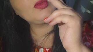 Smoking in a Red Floral Dress.
