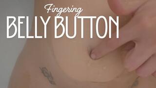 Belly button fingering in bathtub close up