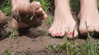 Goddess Samariel and Mistress Long Toenails foot worship in the mud