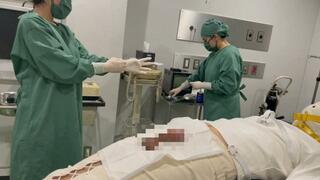 Urethral examination and handjob on a restrained patient