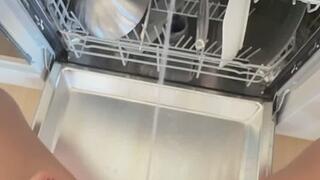 Girl with huge bladder bulge POV pissing into dishwasher