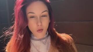 Artemisia Love blowing bubbles and smoking outdoor