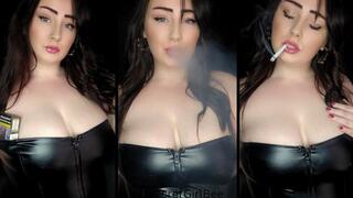 Smoking an all white cigarette in my tight leather dress