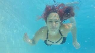 Full body view of me swimming and blowing bubbles