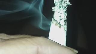Come sit outside this beautiful evening and have a couple of smokes with me! I burnt my leg a bit on an ash at the end?. I feel like I'm breathing a bit heavy but you only see my legs and feet. Close-ups of cigarettes with tons of smoke. Priced ?