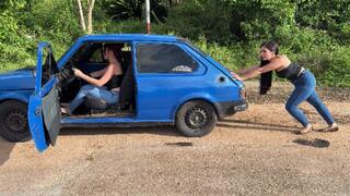 Pedaling barefoot, two girls, a broken-down car in the middle of nowhere