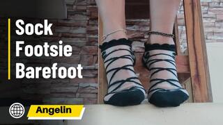 Woman with stockings on her feet moving them until she takes off the stockings (1)