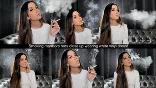 Smoking marlboro reds close up wearing white vinyl dress!
