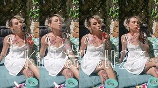 Chain-smoking outdoors in short White dress