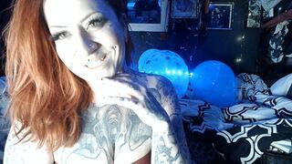 Tattooed Girl Inflating a Mini-Pool and Beach Ball