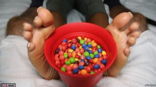 Sugar Soles is shocked to find a dick in her Skittles!! Footjob with huge exploding cumshot!