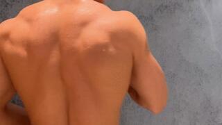 Muscular back shower scene