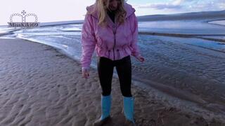 Blonde plays and gets stuck on muddy beach in wellies