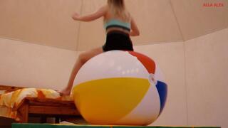 Alla bounces high on a big beach ball and a big fitness ball!!!