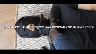 Slave serves as a footstool and doormat for Mistress Cola