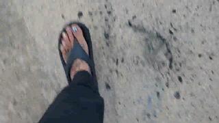 Avi Lola walks in flip flops wiggling her toes and crushing random things in her path