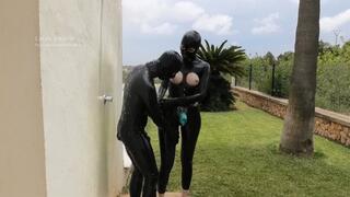 Strap-on fuck under the outdoor shower