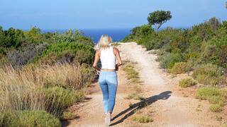 Wetting her Jeans bare foot on island hike HD