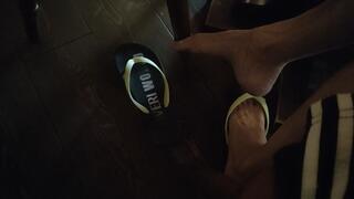 Shoeplay, foot play, dangling, dipping and dropping with flip flop at the restaurant (avi)