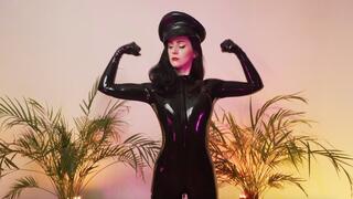Goddess shows off biceps in a black latex catsuit (4K)