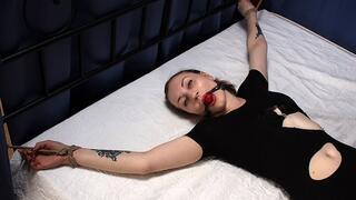 Ballgagged barefoot Amanda in ripped black leotard, bound on the bed with her hands and feet wide-spread, wiggles on the bed (HD MOV)